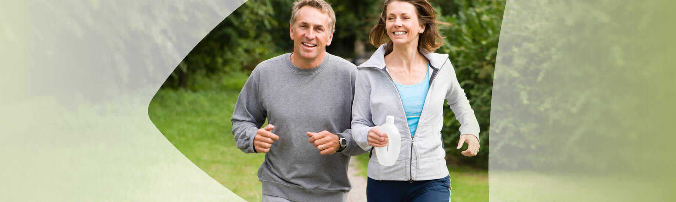 Couple happily jogging together